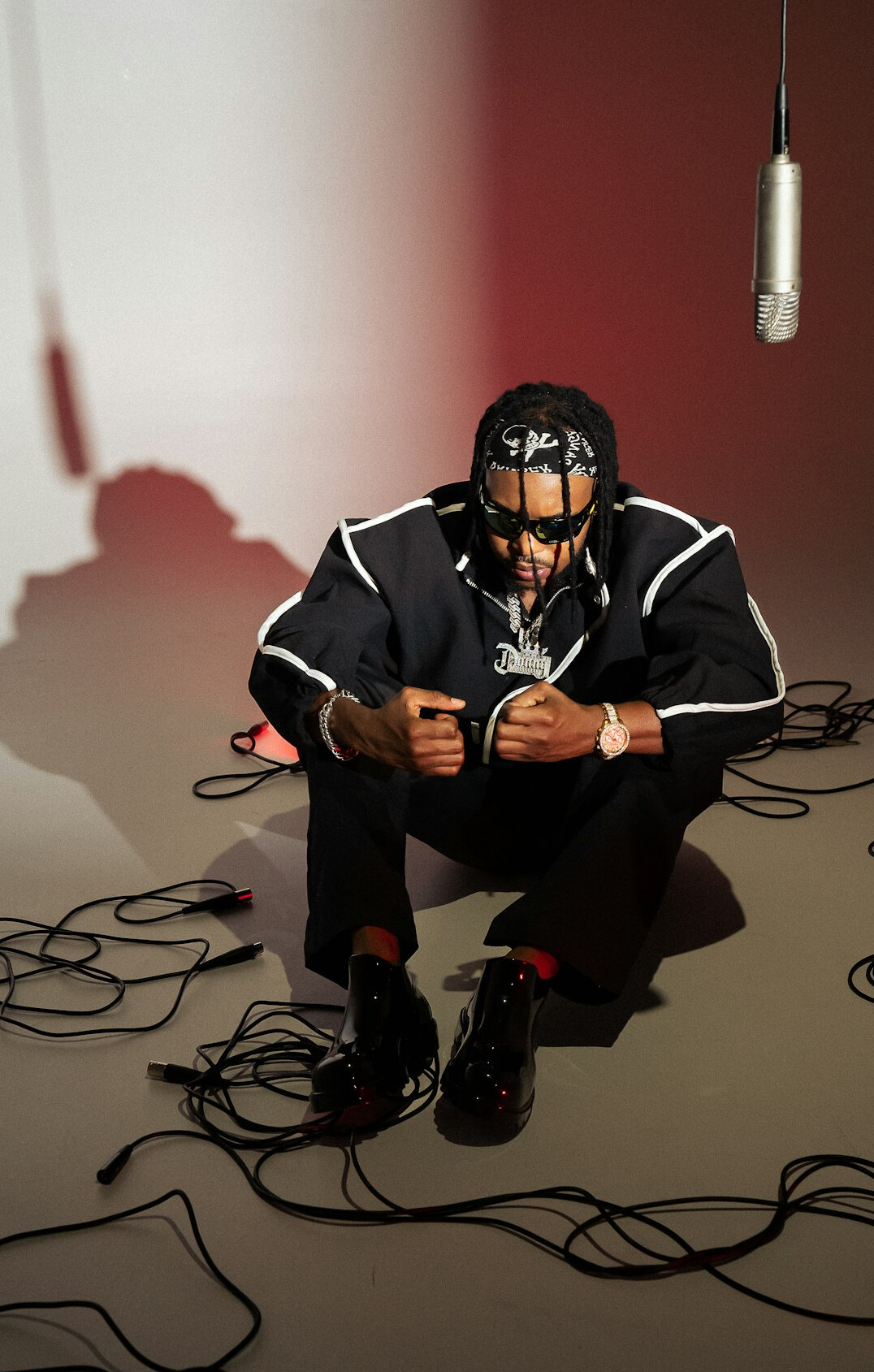 Presenter wearing a lavalier microphone clipped on a shirt in a studio