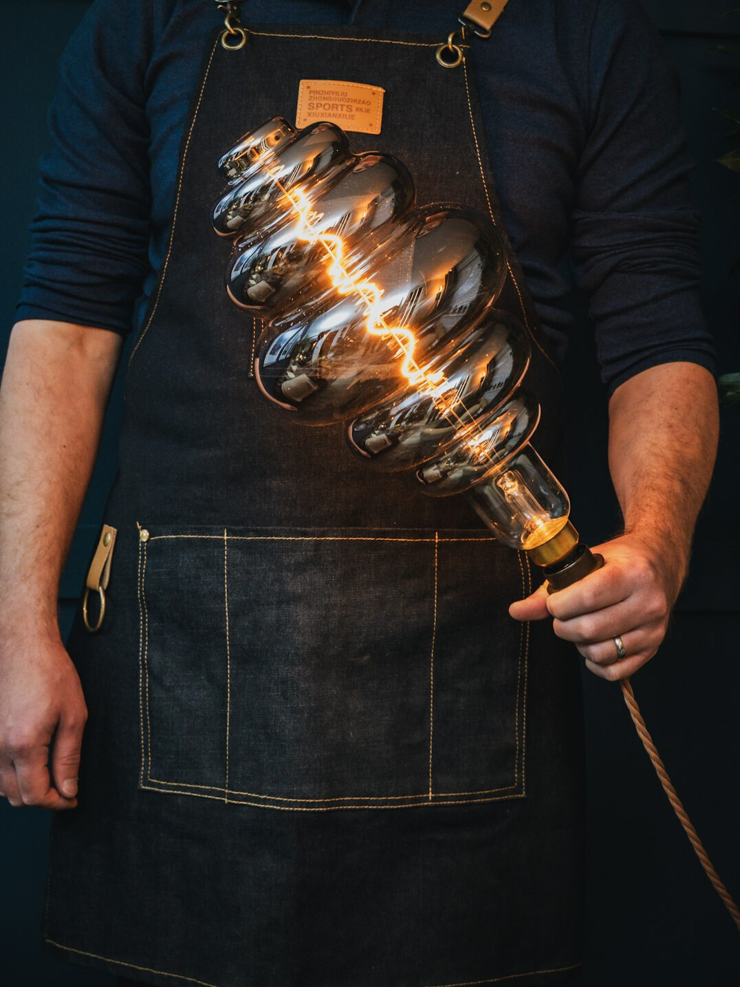 Portrait of a young man lighting designer in a television studio